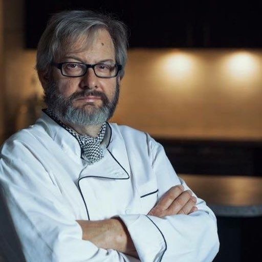 Kenny in chef's uniform.